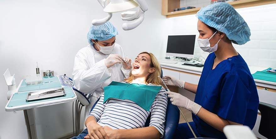 female-dentist-examine-tooth-to-caucasian-girl-at-2024-05-16-17-52-49-utc.jpg